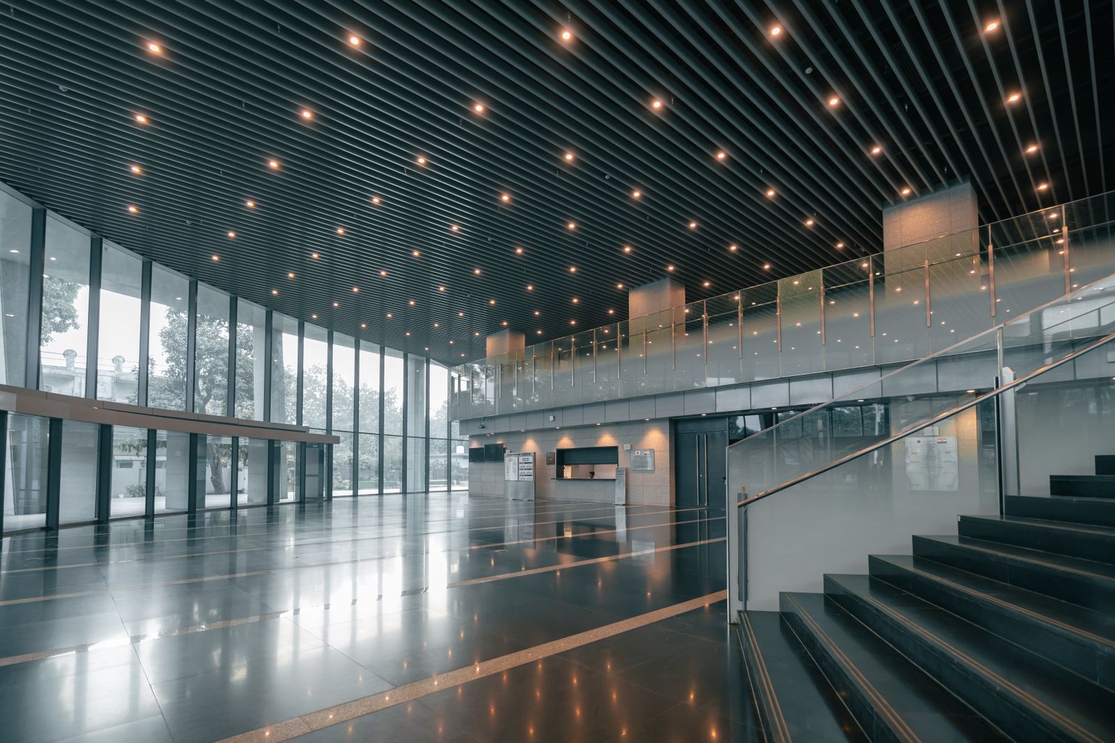 A pristine modern commercial lobby — the standard Harbor City Facility Solutions holds every facility to